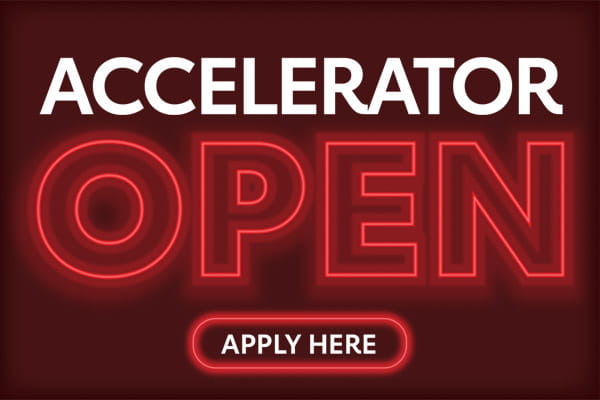 A digital graphic shows "accelerator" in bold white letters on top of "open" in the style of a red neon sign. The words "apply here" appear along the bottom. A digital graphic shows "accelerator" in bold white letters on top of "open" in the style of a red neon sign. The words "apply here" appear along the bottom.